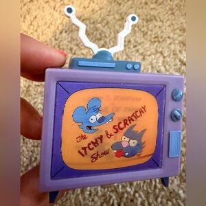 The Simpsons HomeKit replacement TV itchy and scratchy show